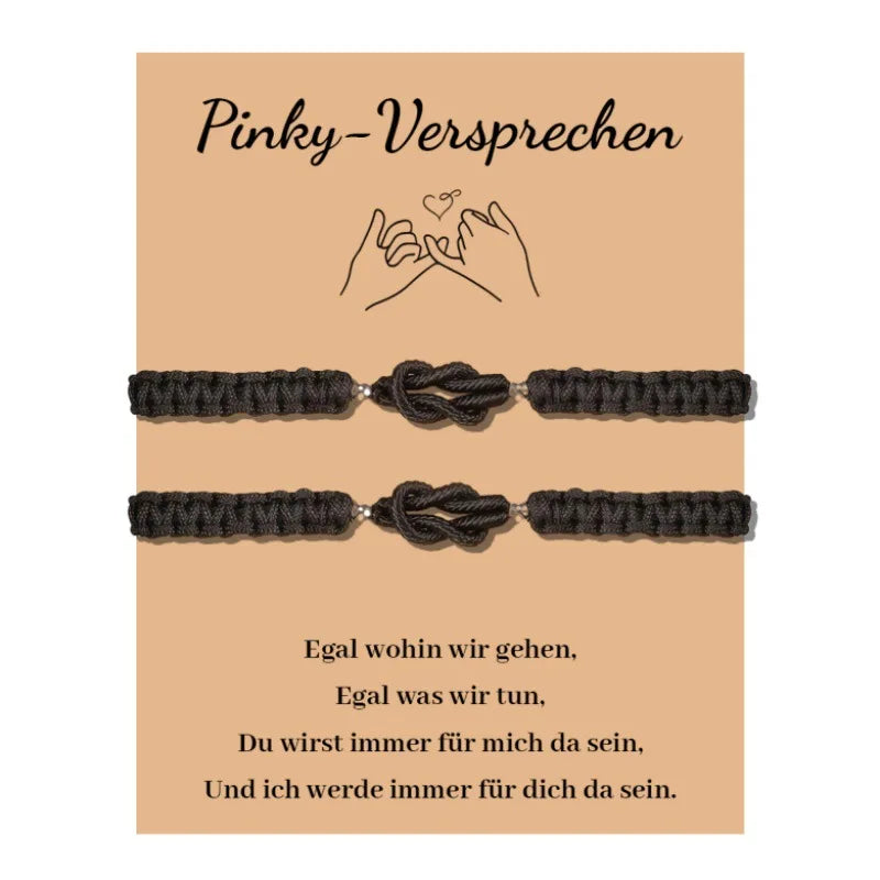 Two black love knot bracelets displayed on a beige card with German text.