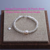 A silver bead bracelet featuring 5A freshwater pearls and 4mm silver beads with a double heart charm.