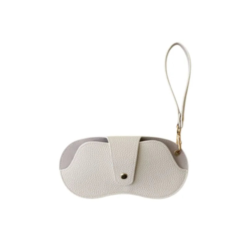 A light beige PU leather eyewear storage case with a thin gold chain.
