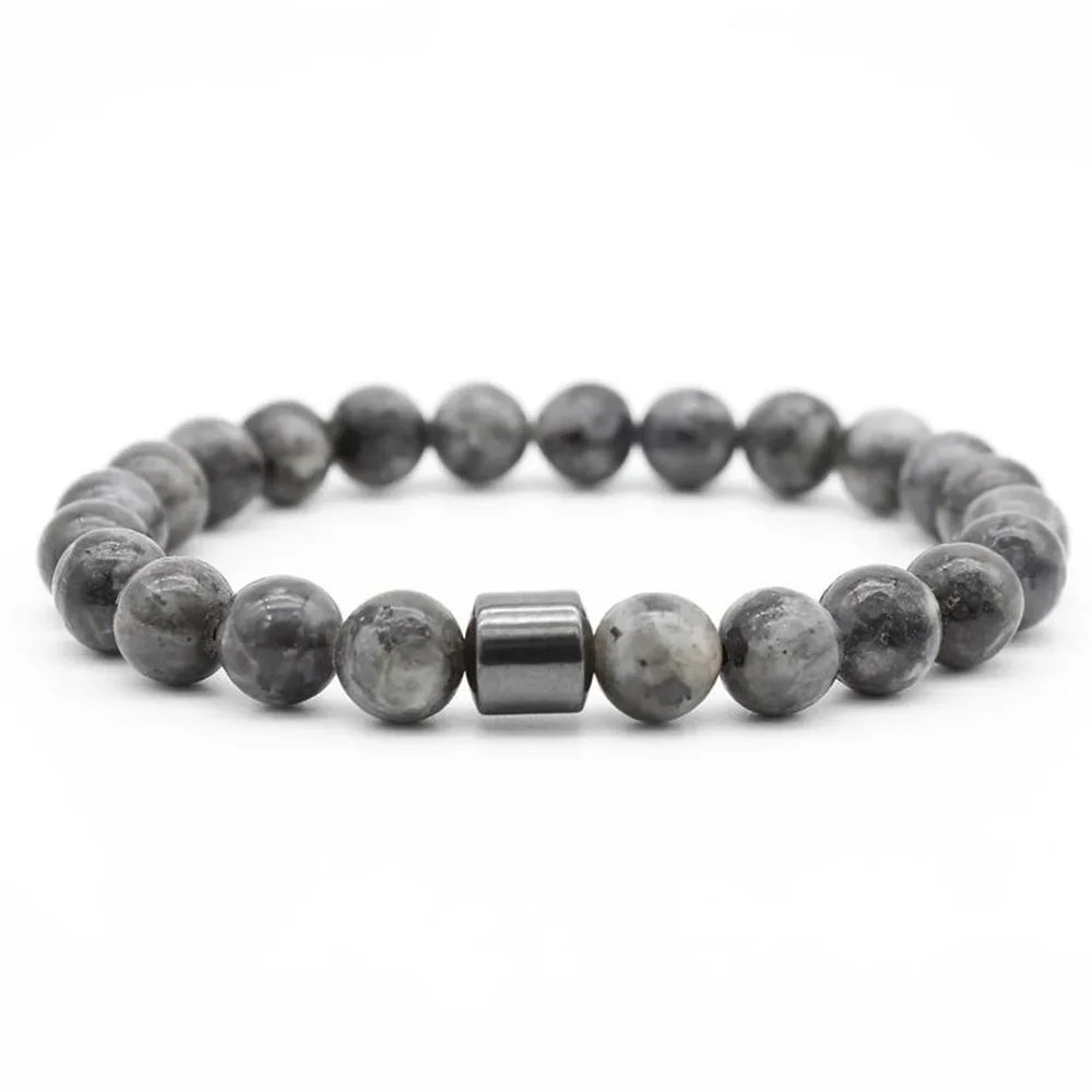A bracelet made of polished grey and black tiger eye lava map beads.