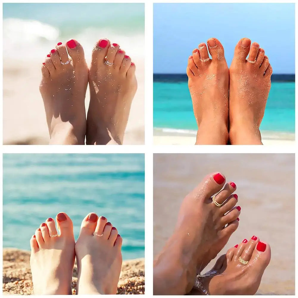 A set of adjustable open toe rings worn on female feet against a beach background.