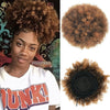 A woman shows off a voluminous, curly brown hairstyle featuring Kinky Drawstring Ponytail Extension.
