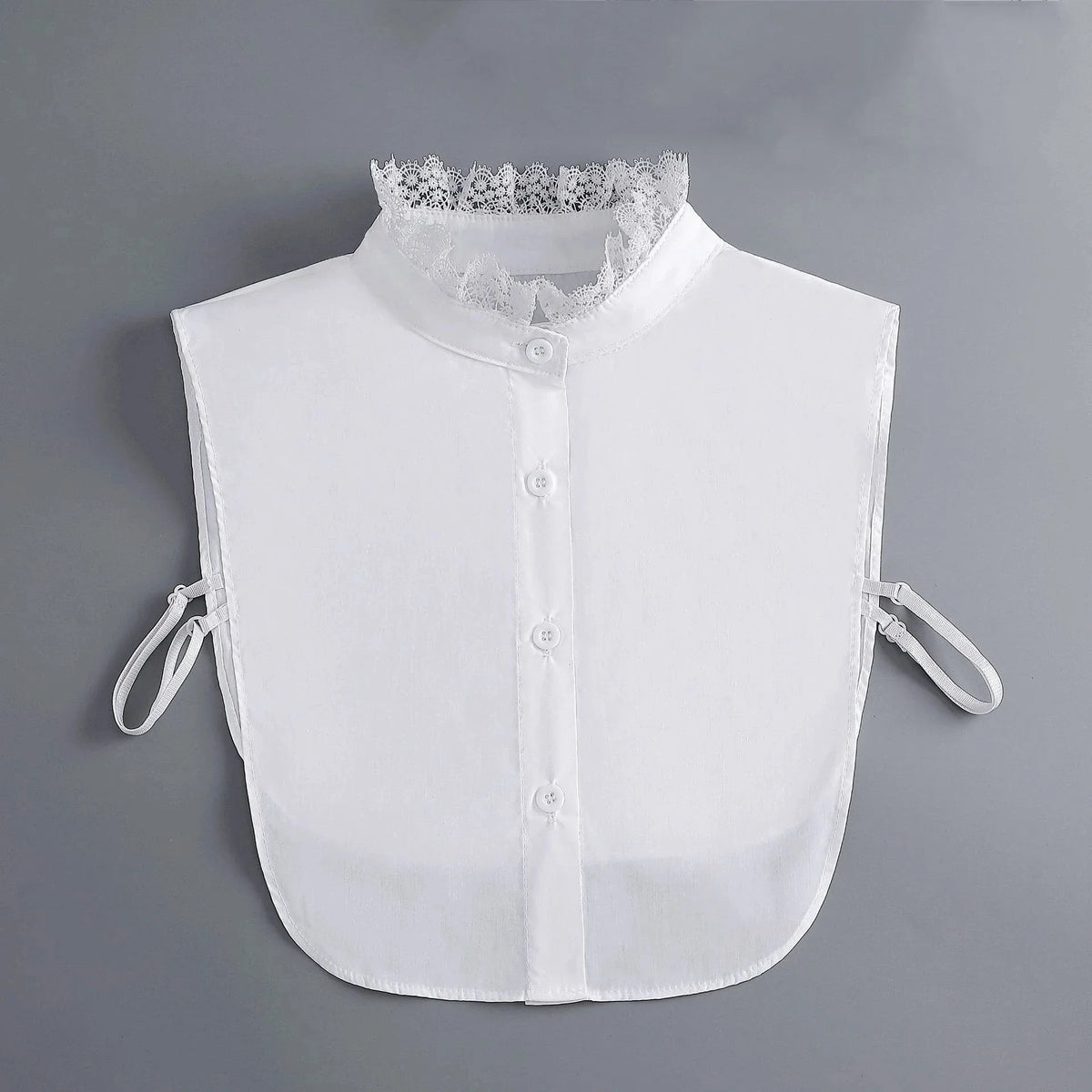 White blouse with a false collar and detachable neckline, shown flat lay.