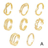 A set of gold adjustable open toe rings for women displayed against a white background.