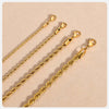 A close-up photo of a dainty gold rope chain necklace with a lobster clasp.