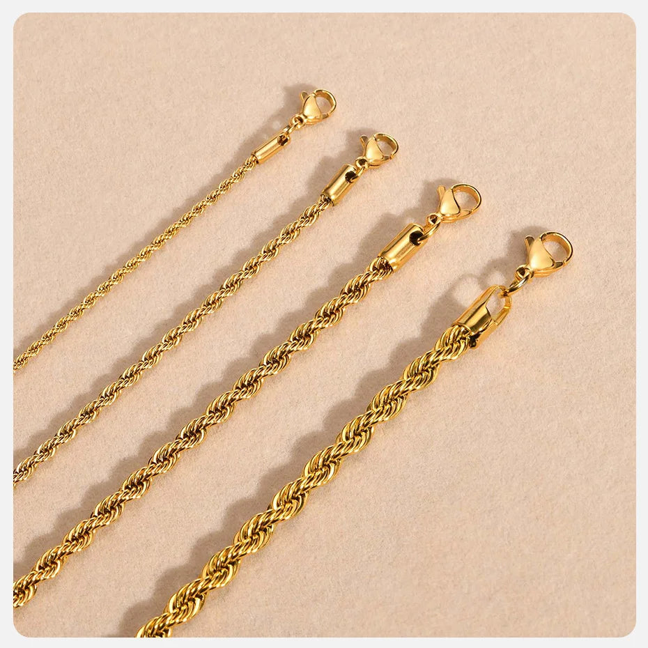 A close-up photo of a dainty gold rope chain necklace with a lobster clasp.