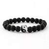 Black Yin Yang hand string bracelet with a silver pendant