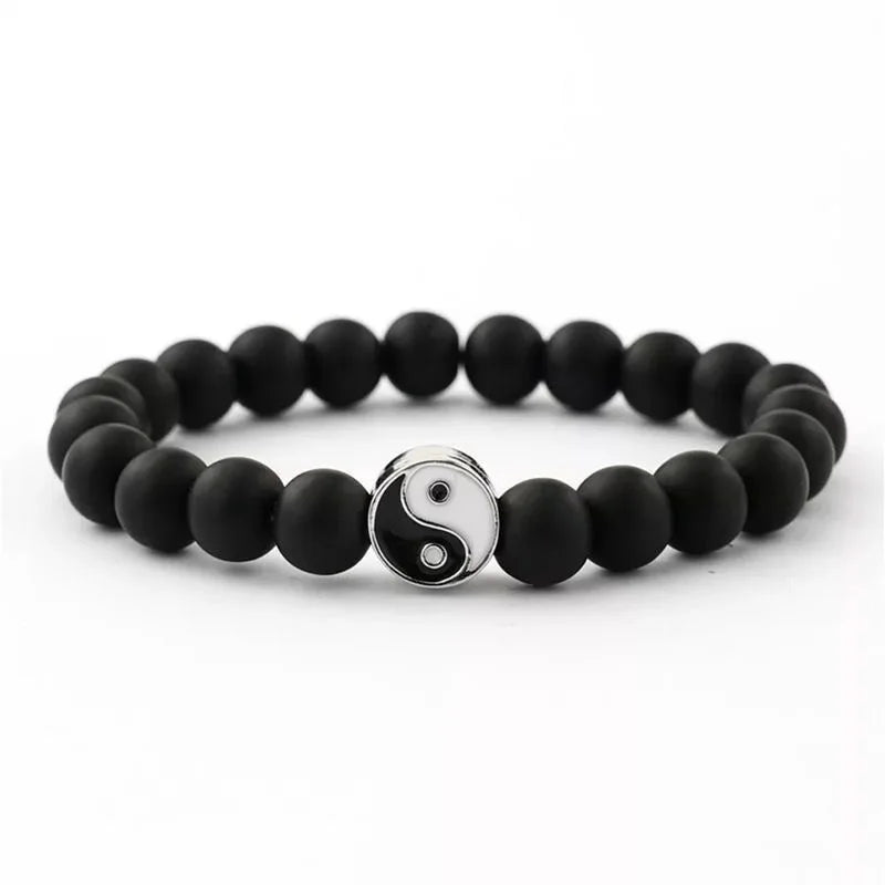 Black Yin Yang hand string bracelet with a silver pendant