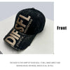 A black embroidered letter baseball cap with gold lettering on the front.