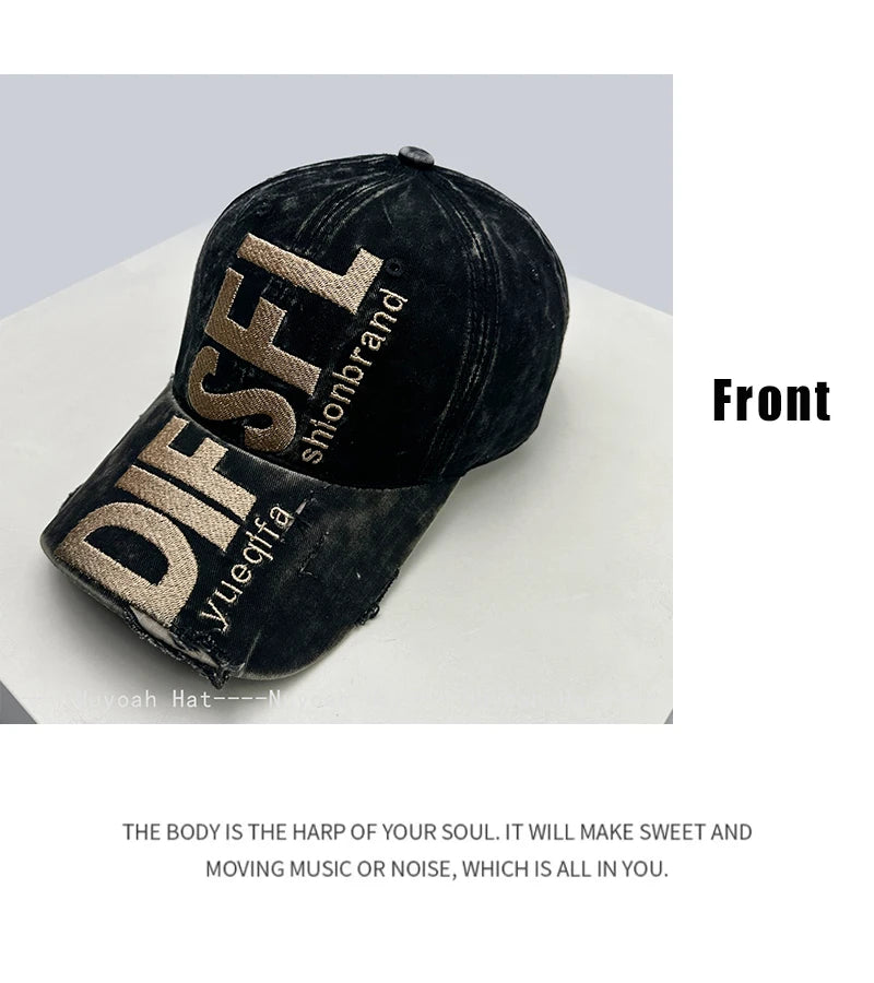 A black embroidered letter baseball cap with gold lettering on the front.