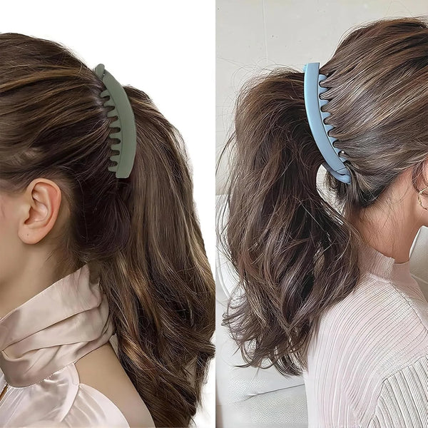A woman's hair is styled in a ponytail using large, curved banana-shaped clips for a professional look.