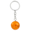 A round, orange-yellow acrylic charm with a red star, attached to a silver keyring.