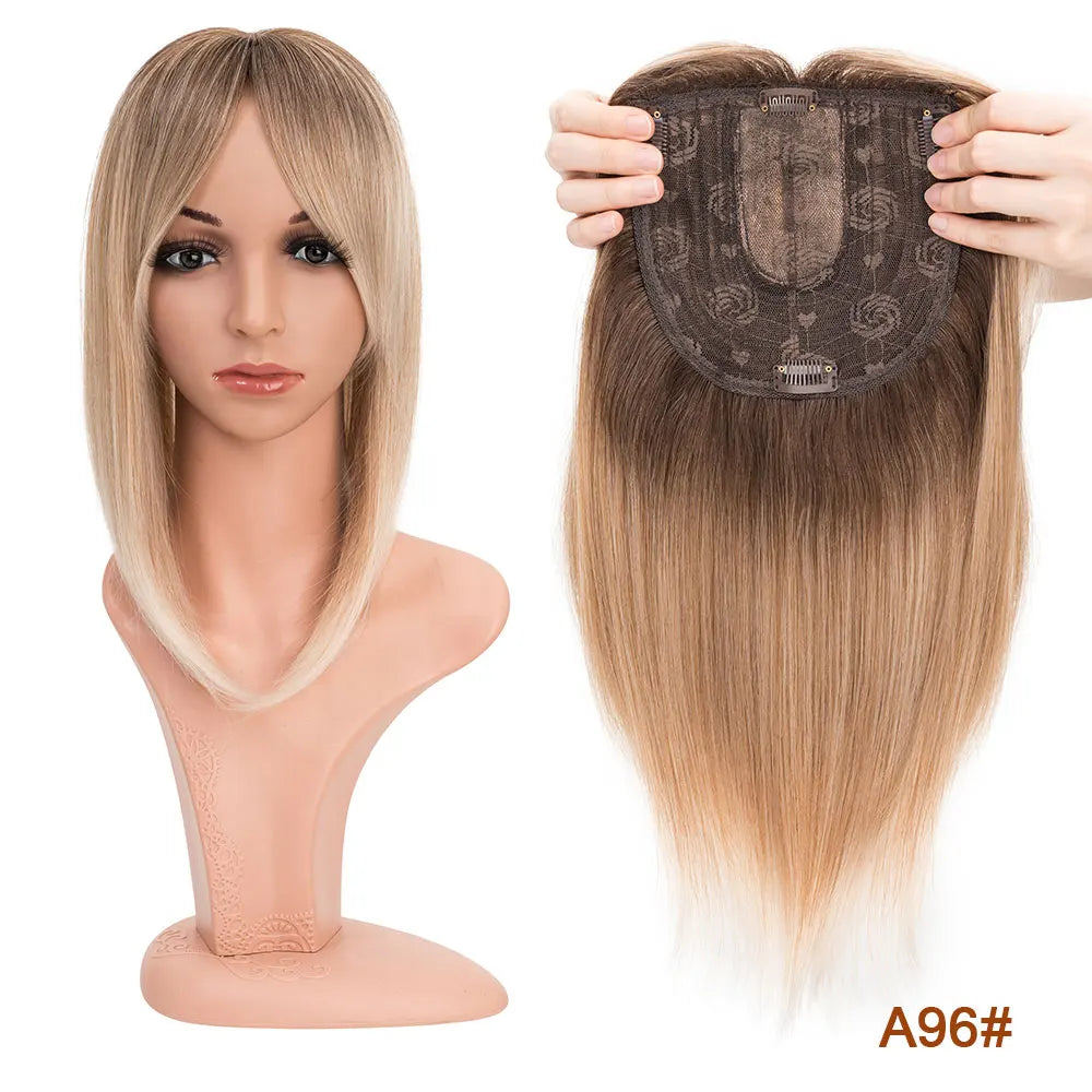 A model shows a straight blonde hair topper with bangs being placed onto her head for volume and coverage.