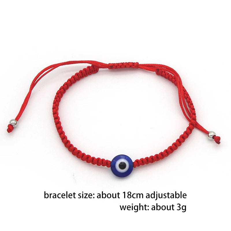 Red thread bracelet with a blue evil eye charm for protection