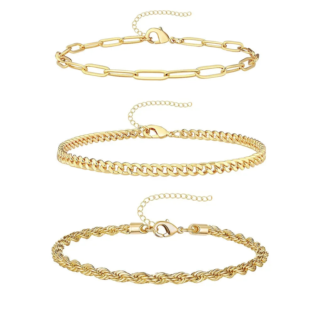 A set of three gold-toned waterproof stainless steel anklets for women displayed against a white background.