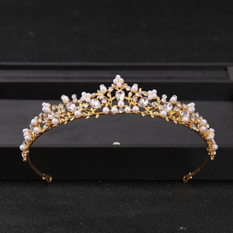 Gold-toned bridal tiara headpiece adorned with clear crystals and white pearls.
