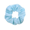Light blue satin scrunchie tied in a bow shape