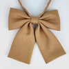 A tan ribbed fabric bow tie set with a butterfly shape for students