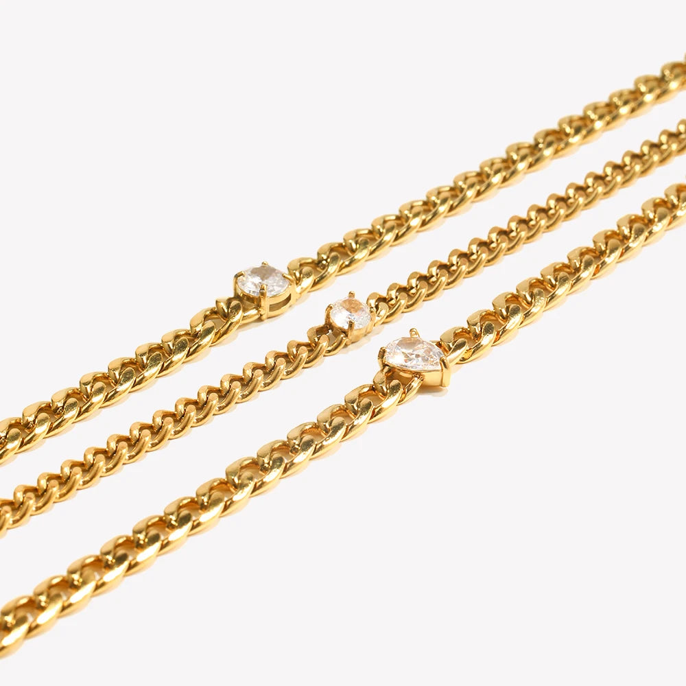 Gold chain bracelet featuring round water drop zircon charms