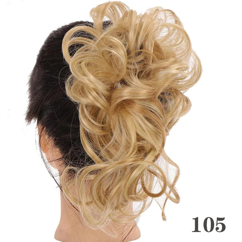 A woman's dark hair is styled into a voluminous, messy blonde bun using synthetic hairpiece.