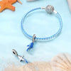 Sterling silver devil's eye charm bracelet with a blue bead and silver clasp on a light blue background