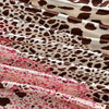 Close-up of a flowing fabric featuring a brown and white leopard print in satin material.