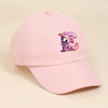 A pink baseball cap featuring a purple and white rainbow unicorn embroidered on the front.