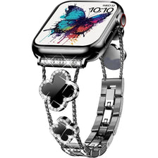 A close-up of a black smartwatch with a colorful butterfly display and a silver metal band.
