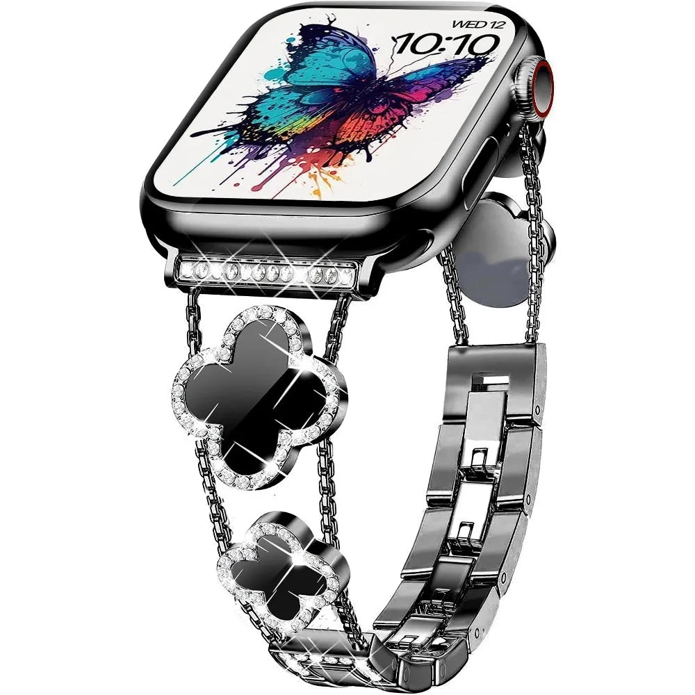 Gros plan d'une montre connectée noire avec un affichage papillon coloré et un bracelet en métal argenté.