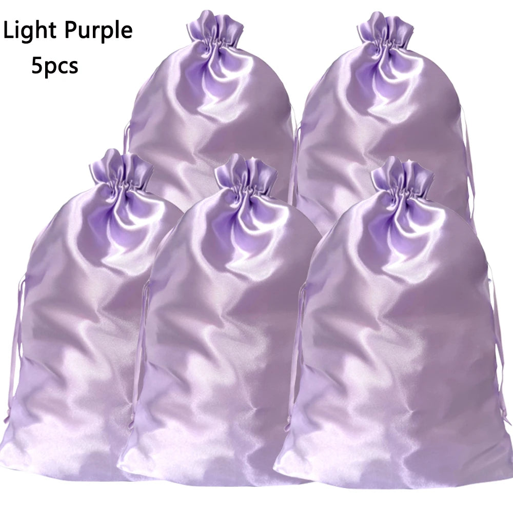 Five purple satin drawstring storage bags for hair tools