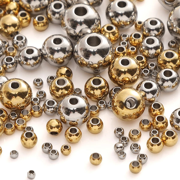 A collection of silver and gold stainless steel spacer beads for DIY jewelry making