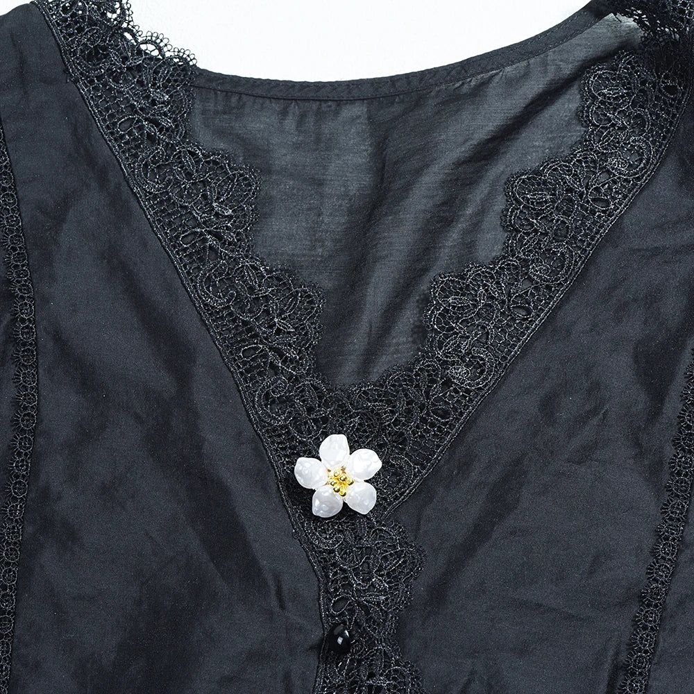 Dark gray velvet shirt with black lace trim and a white pearl button cover