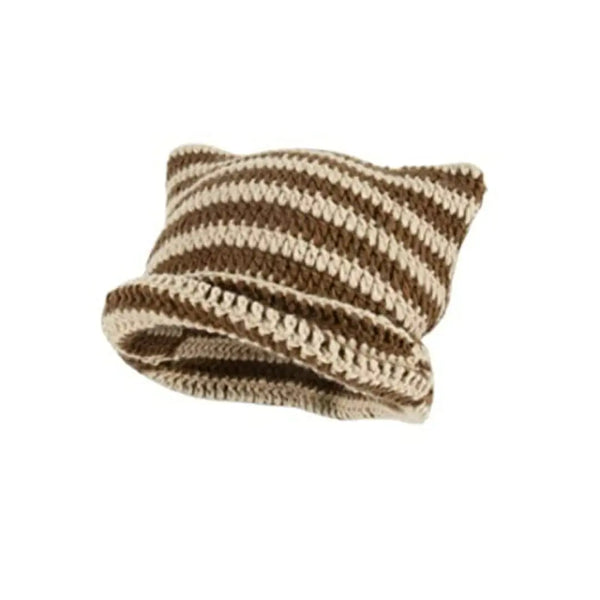 A knitted beanie hat with striped brown and cream yarn, featuring a textured, crocheted design.