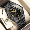 A black leather strap watch with a silver bezel and gold-toned hands is displayed in a box.