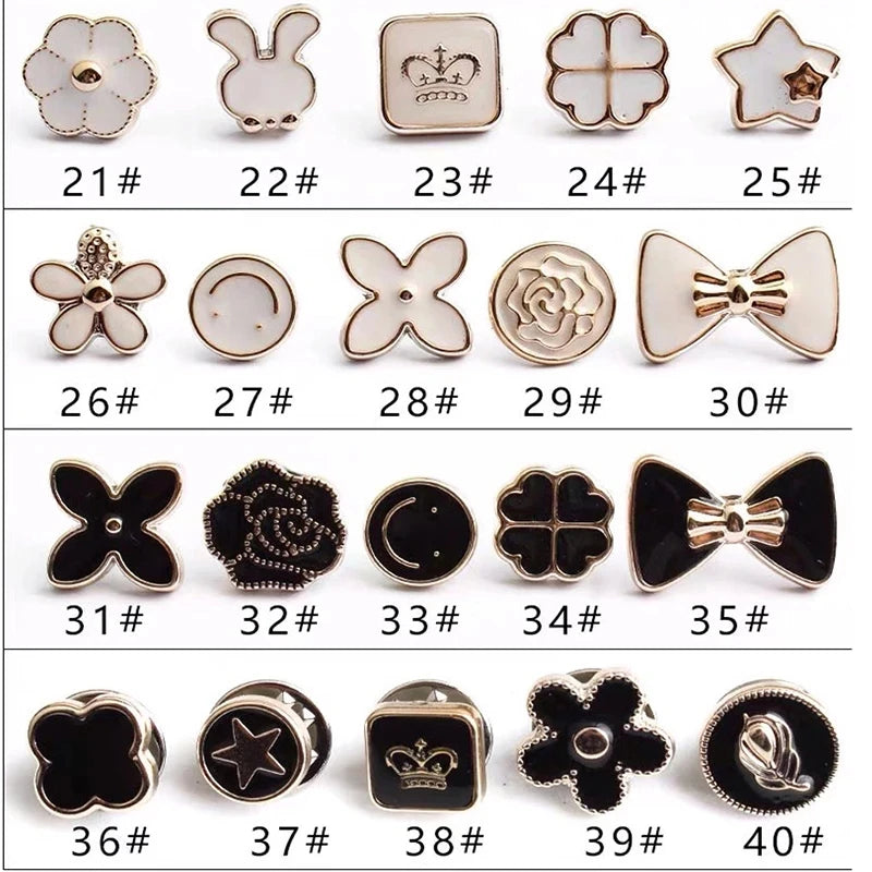 A collection of elegant button and flower brooch pins in various shapes and finishes.