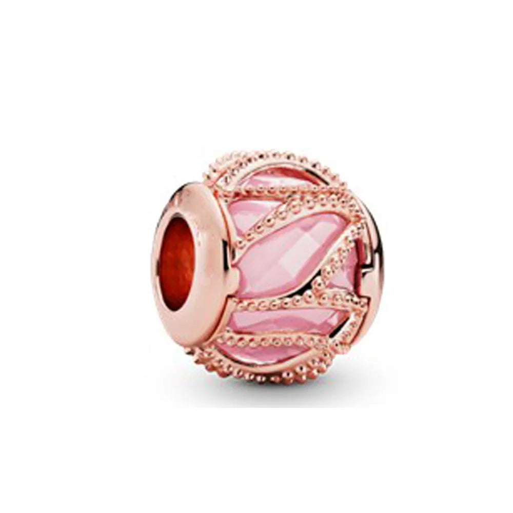 Rose gold cherry blossom charm pendant featuring pink gemstone and textured metalwork