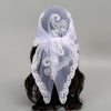 White floral embroidered lace bandana headscarf tied around dark hair