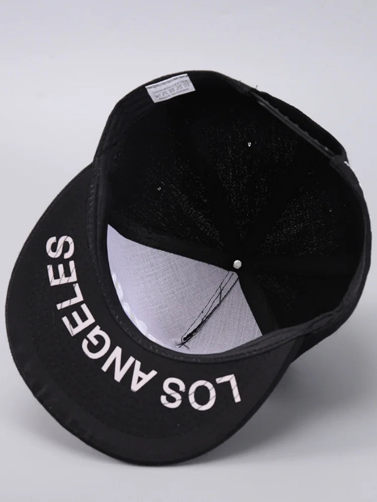 Black Los Angeles embroidered baseball cap shown from above