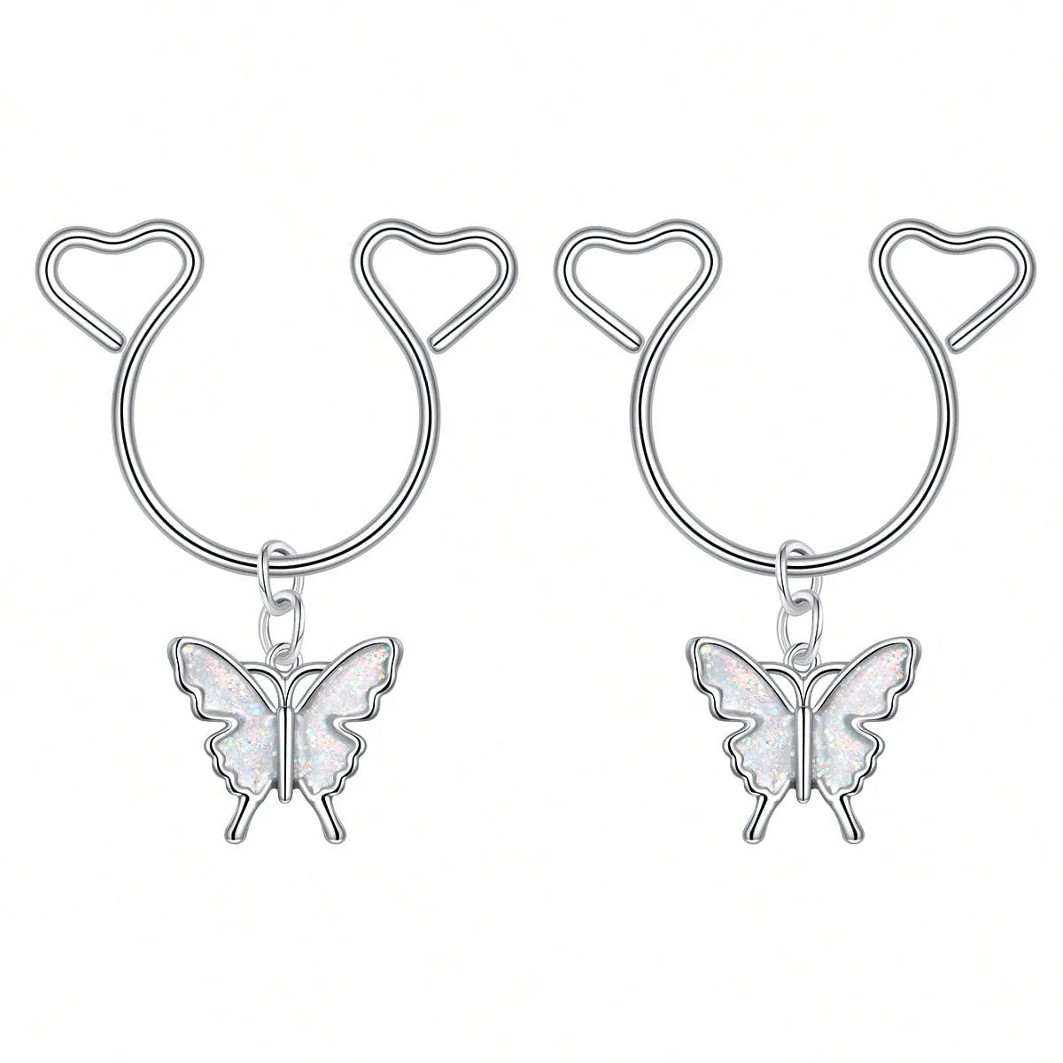 A pair of silver heart dangle non-piercing nipple rings with cubic zirconia charms.