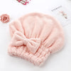 A soft pink microfiber hair drying towel is shown next to a rose and a card with the word eternity.