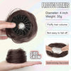 A hand holds a dark brown synthetic hair bun with elastic clips, showing the texture and size of the hair.