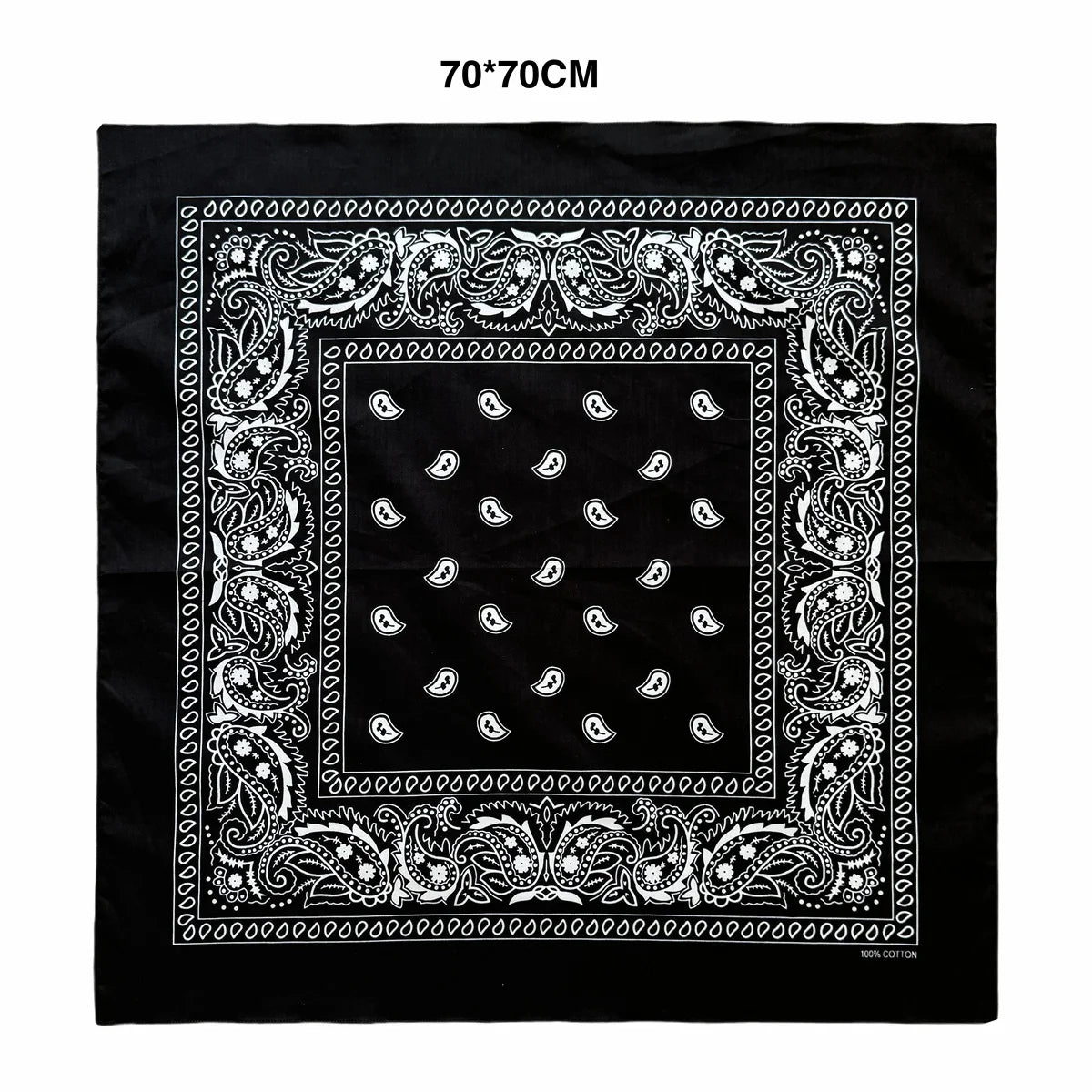 Black fabric with an ornate white paisley border and repeating paisley pattern on a square design