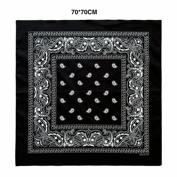 Black fabric with an ornate white paisley border and repeating paisley pattern on a square design