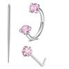 A set of silver-toned horseshoe nose rings featuring pink cubic zirconia stones.