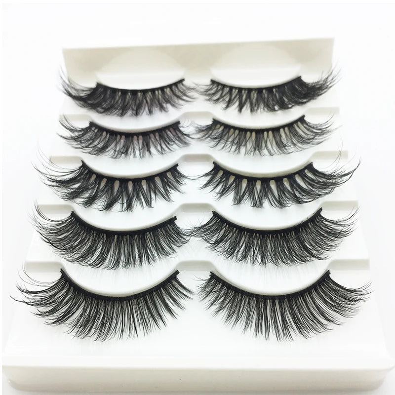 A set of handmade 3D mink false eyelashes displayed in a white plastic tray.