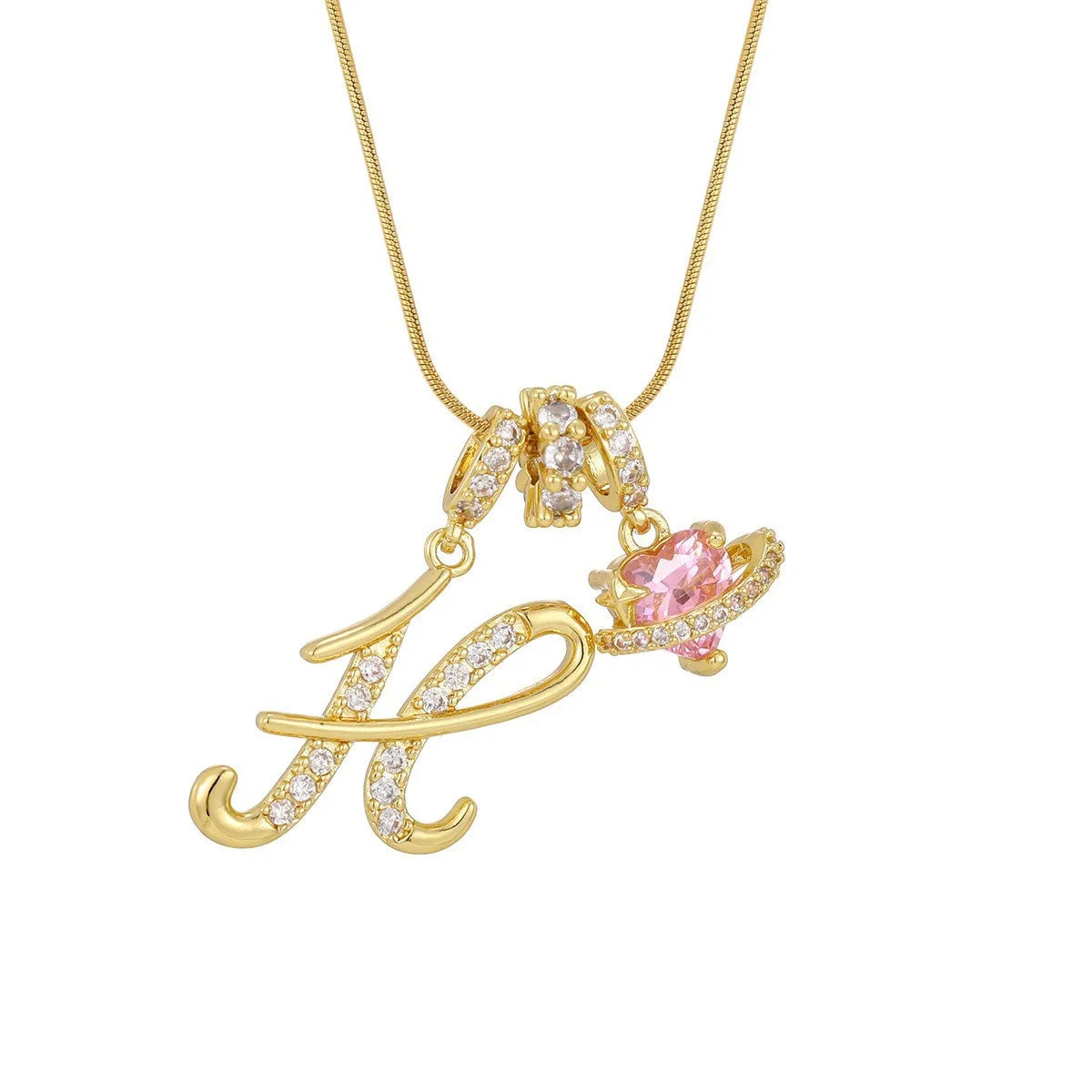 Gold letter K pendant necklace with pink gemstone accent