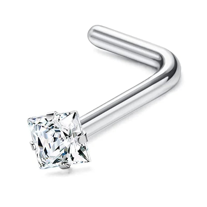 Surgical stainless steel nose piercing stud with a clear diamond-cut gemstone and a curved bar.