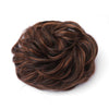 A dark brown, messy bun hairstyle for curly updos.