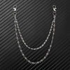 A silver double-layer waist chain accessory displayed against a dark, striped background.