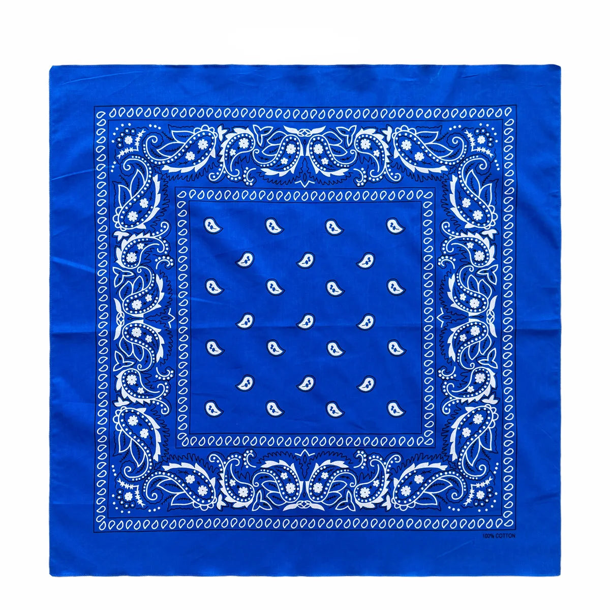 Blue fabric with white paisley and geometric patterns on a square design